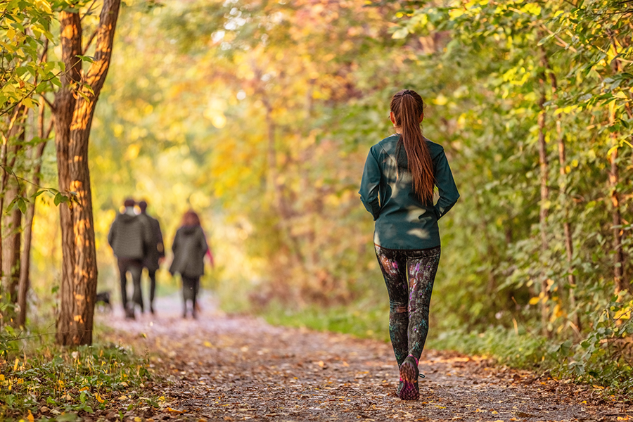 Girl walking in forest.