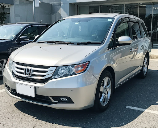 Honda Odyssey in Singapore, front plate area concealed with blank plate, no numbers or letters visible